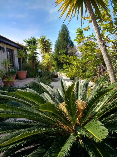 A charming villa set in beautiful gardens with sea & mountain views 