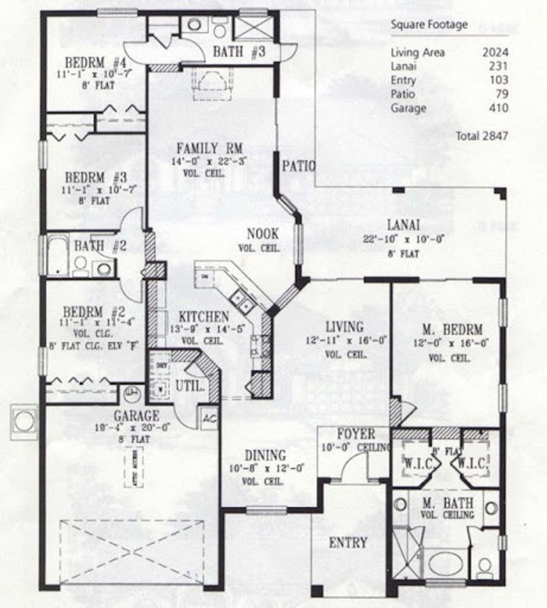 Un plan d’étage d’une maison comprenant quatre chambres, deux salles de bain, une cuisine, un coin repas, un salon, une salle familiale, un garage et une véranda.