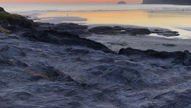 A rocky beach with calm waters and a clear sky. - Westward 14, Polzeath, North Cornwall  (Polzeath)