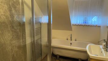 Bathtub, hair dryer, towels, soap