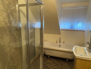 Bathtub, hair dryer, towels, soap