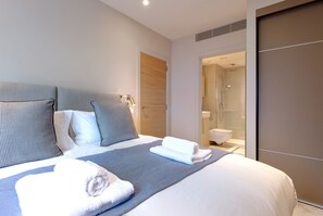 3 bedrooms, premium bedding, laptop workspace, iron/ironing board
