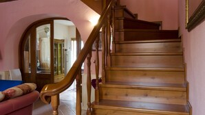 A wooden staircase with a handrail, leading to an upper floor. - detached house with garden, kitchen, laundry, bathroom with jacuzzi  (Decollatura)