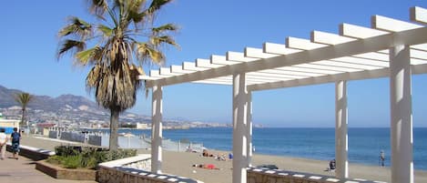 On the beach, sun-loungers, beach towels
