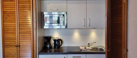 Fridge, microwave, coffee/tea maker, toaster