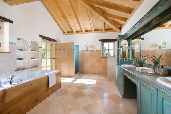 A spacious bathroom with a large wooden bathtub, two sinks, and a walk-in shower. - First class luxury villa with big pool, 1000sqm living area, 30000 sqm garden (porec)