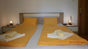 A double bed with two pillows and two bedside tables with lamps. - Charming room Dijana with air conditioning & Wi-Fi (Krk)