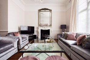 Smart TV, fireplace, books, music library