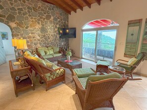 TV - Experience the enchanting allure of La Collina – a stunning home that boasts breathtaking sunset views & ocean views, a refreshing pool, and air conditioning. Elevate your lifestyle in this picturesque retreat! (St John)