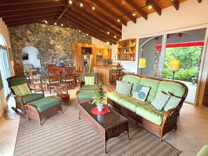 TV - Experience the enchanting allure of La Collina – a stunning home that boasts breathtaking sunset views & ocean views, a refreshing pool, and air conditioning. Elevate your lifestyle in this picturesque retreat! (St John)