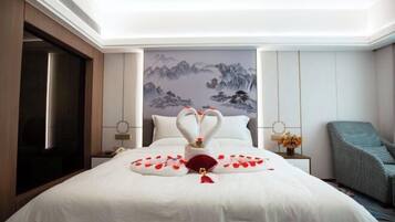 A hotel room with a bed, a painting on the wall, a nightstand, a chair, and a door.