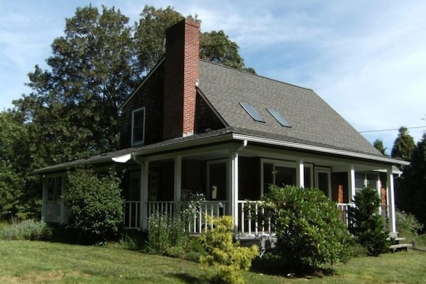 Windward Cottage, view of the property and the large wrap-around porch.
