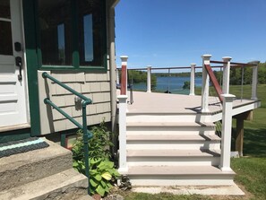Enjoy a scenic view from the deck overlooking the water.