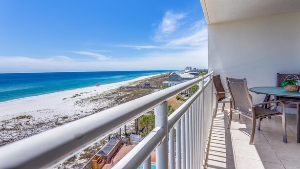 A balcony with a view of a beach and ocean. - SUN, SAND & SURF! (Pensacola)