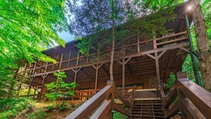 A wooden staircase leading to a building surrounded by trees. - Babbling Brook - 10 Minutes from Downtown Blue Ridge (Blue Ridge)