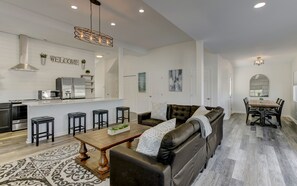 Kitchen, living room, dining area.