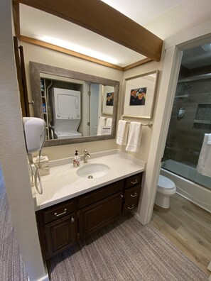 Combined shower/tub, hair dryer, towels, soap