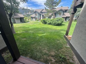 A residential area with houses, a grassy yard, and a mountain backdrop. - Snowcreek, in the meadow! (Mammoth Lakes)