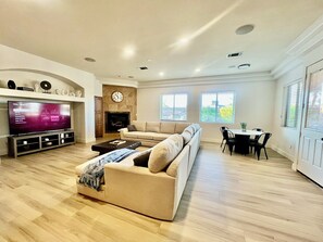 Smart TV, fireplace, table football, books