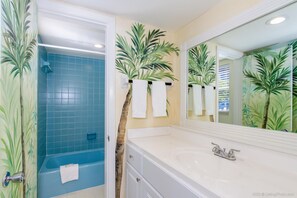 Combined shower/tub, hair dryer, towels, soap