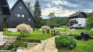 A stone pathway leading to a rustic building with a stone wall and a wooden fence. - Deluxe suite in the middle of Plitvice lakes (Plitvice lakes)