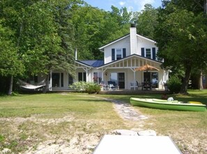 View from the dock/lake. Mere steps to the sand beach, dock, and lake!