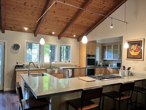 Kitchen with counter seating. 