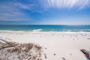A beach with a pier and a boardwalk. - SUNRISE VIEW! Full Kitchen & Living Room Hotel Suite! (Gulf Shores)