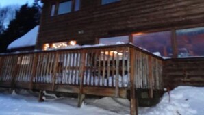 A wooden building with multiple windows and a deck area. - Musician's Paradise With Spectacular Views (Homer)
