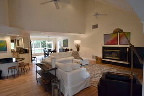 Smart TV, fireplace, books, printers