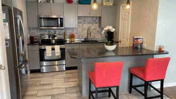 Coffee/tea maker, fridge, microwave, oven