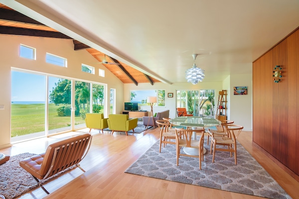 Grand living room and dining room with ocean views - there is a step down.