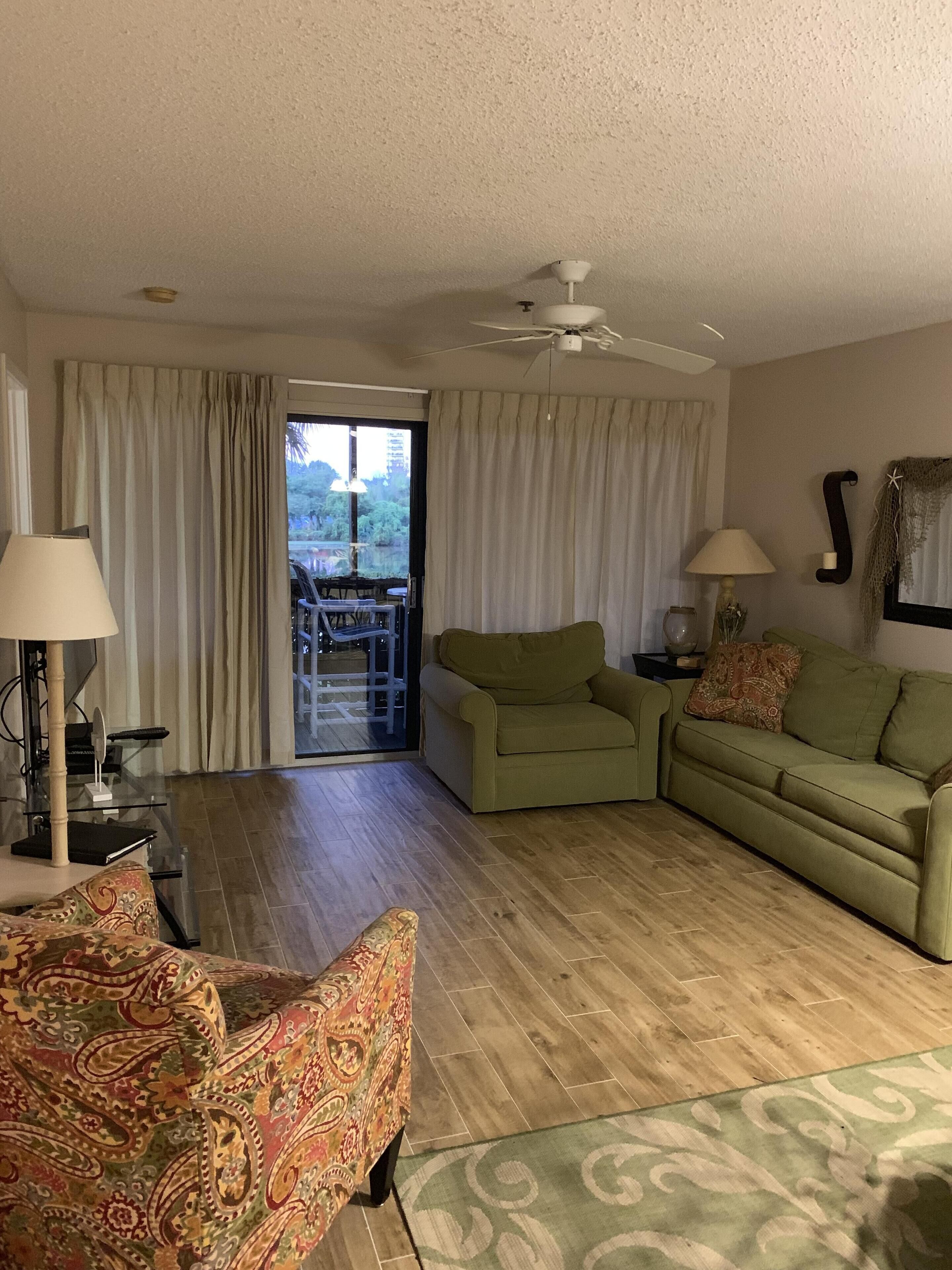 1st Floor Unit on Lake in Laurel Court. Private Pool. Short walk to the beach