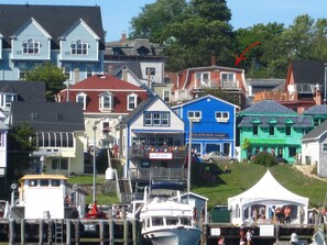Experience the vibrant waterfront area with stunning views, galleries, and bustling activity.