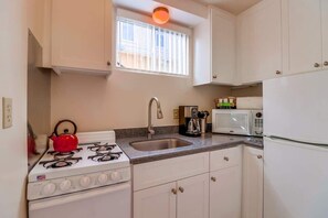 Fridge, microwave, stovetop, coffee/tea maker