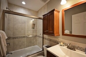 Bathtub, hair dryer, towels, soap