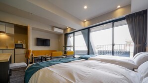 A hotel room with a large bed, a desk with a chair, a TV, and a balcony with a view. - RESI STAY HEART (Kyoto)