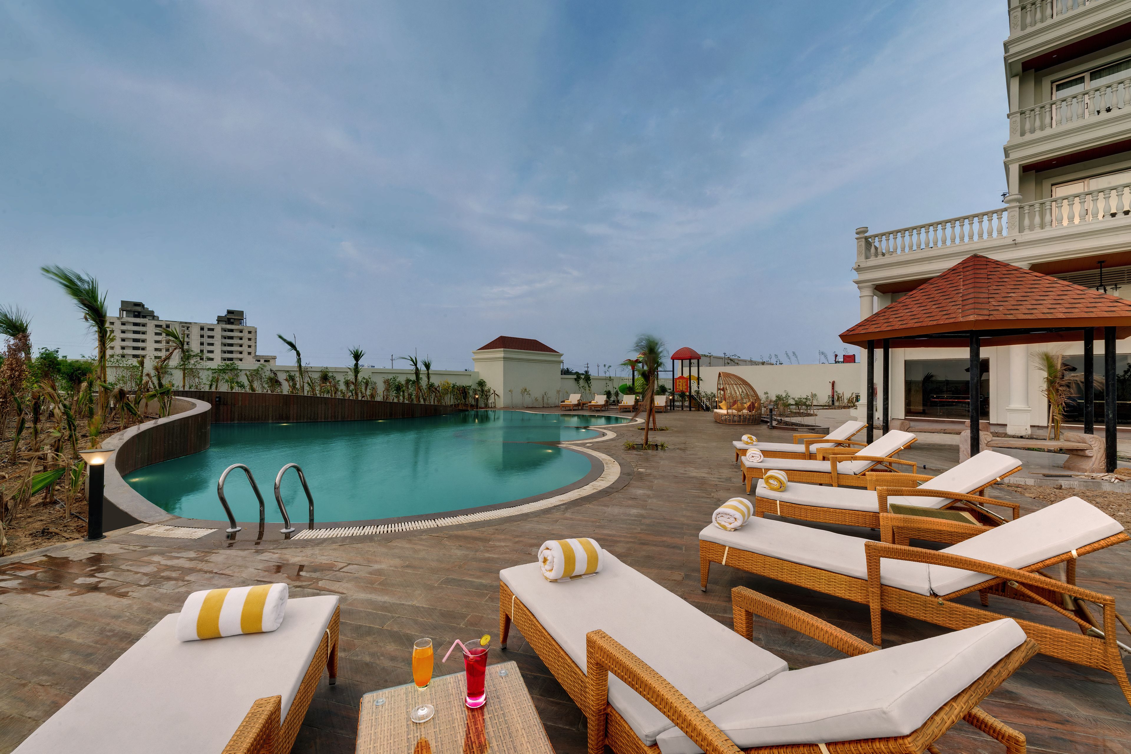 Outdoor pool, open 7:00 AM to 7:00 PM, pool loungers