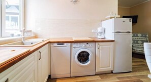 Apartamento (13) | Cozinha americana privada | Geladeira, fogão, cooktop, cafeteira/chaleira