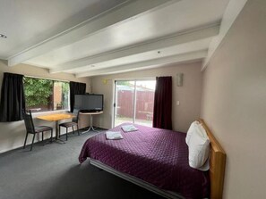 Basic Studio | Premium bedding, desk, blackout drapes, iron/ironing board