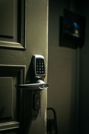 A door with a keypad lock. - URBN Dreams (Berlin)