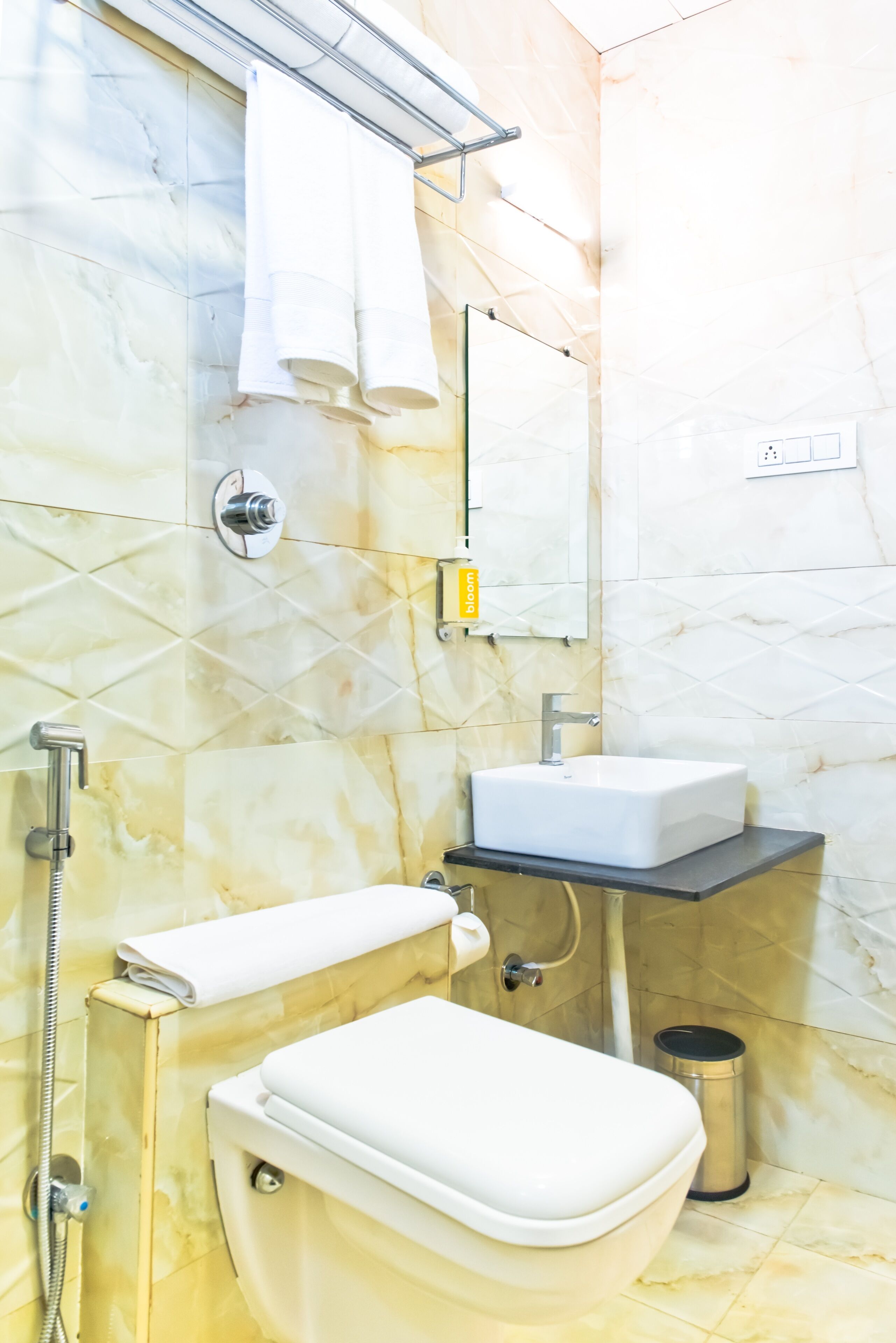 A bathroom with a toilet, sink, and shower.