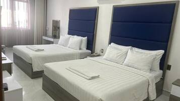 Family Room, City View | Desk, soundproofing, free WiFi, bed sheets