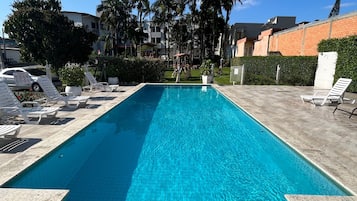 Outdoor pool, open 8:00 AM to 11:00 PM, pool loungers
