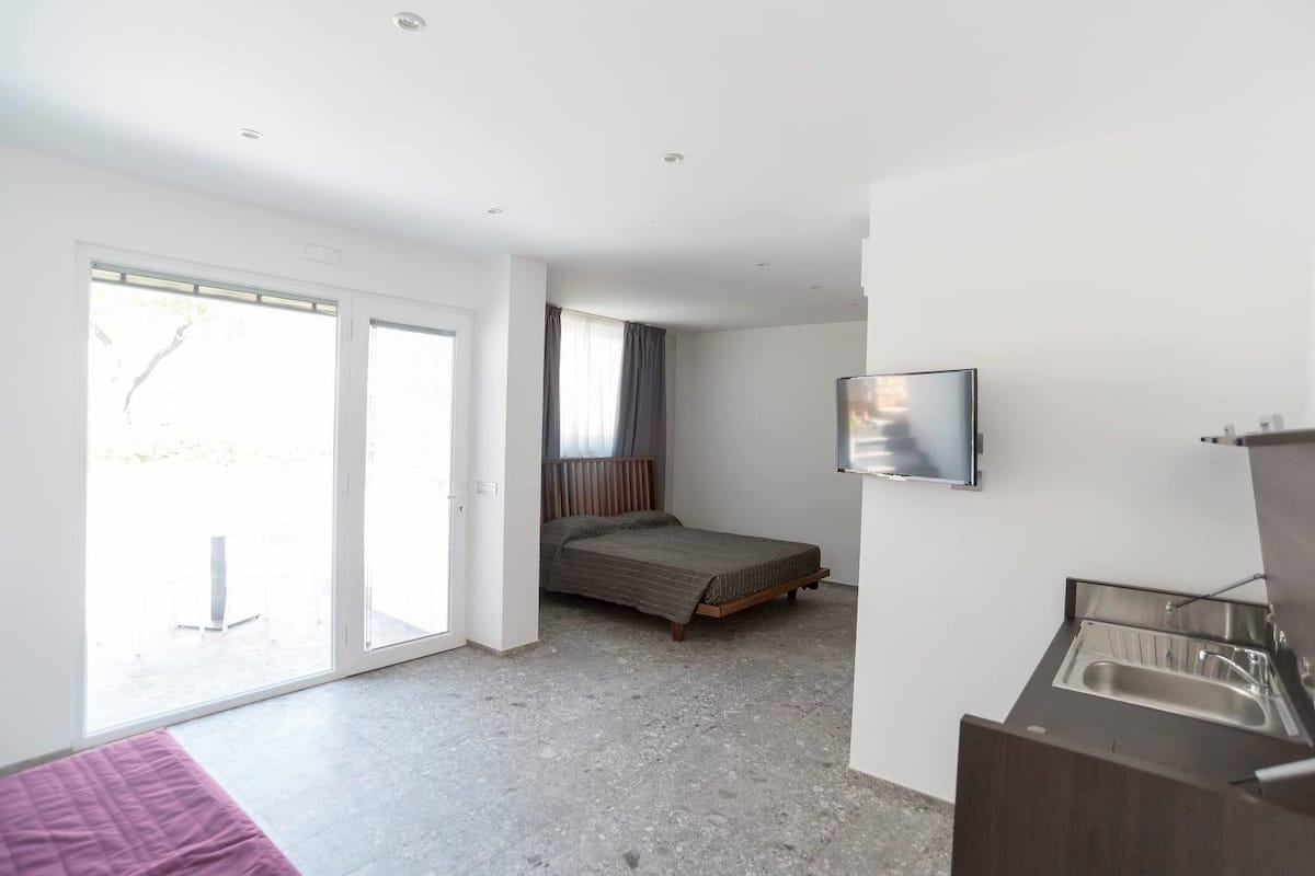 classic double room, kitchenette, patio | in-room safe, desk, soundproofing, cots/infant beds