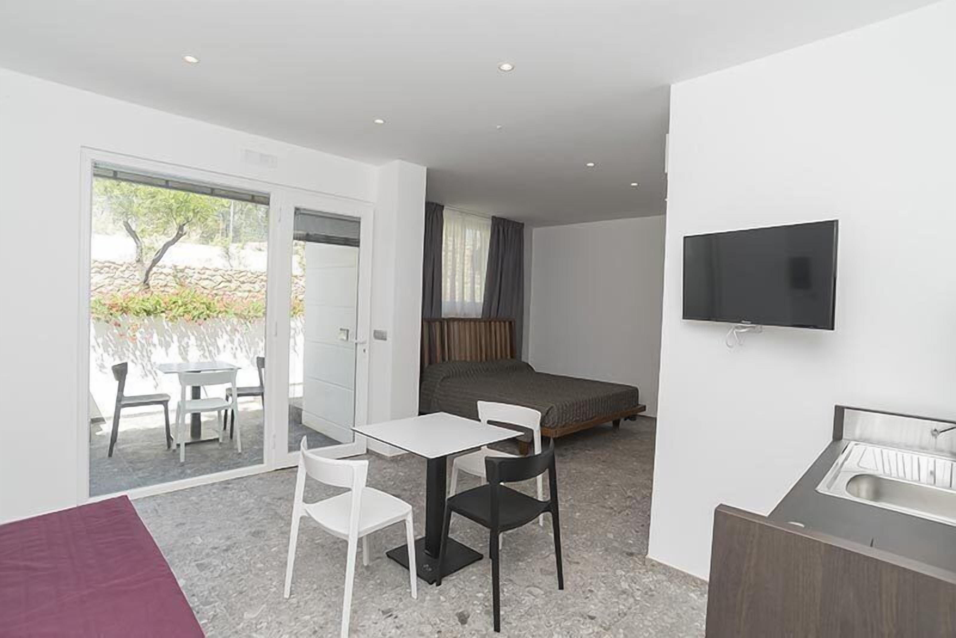 classic double room, kitchenette, patio | in-room safe, desk, soundproofing, cots/infant beds