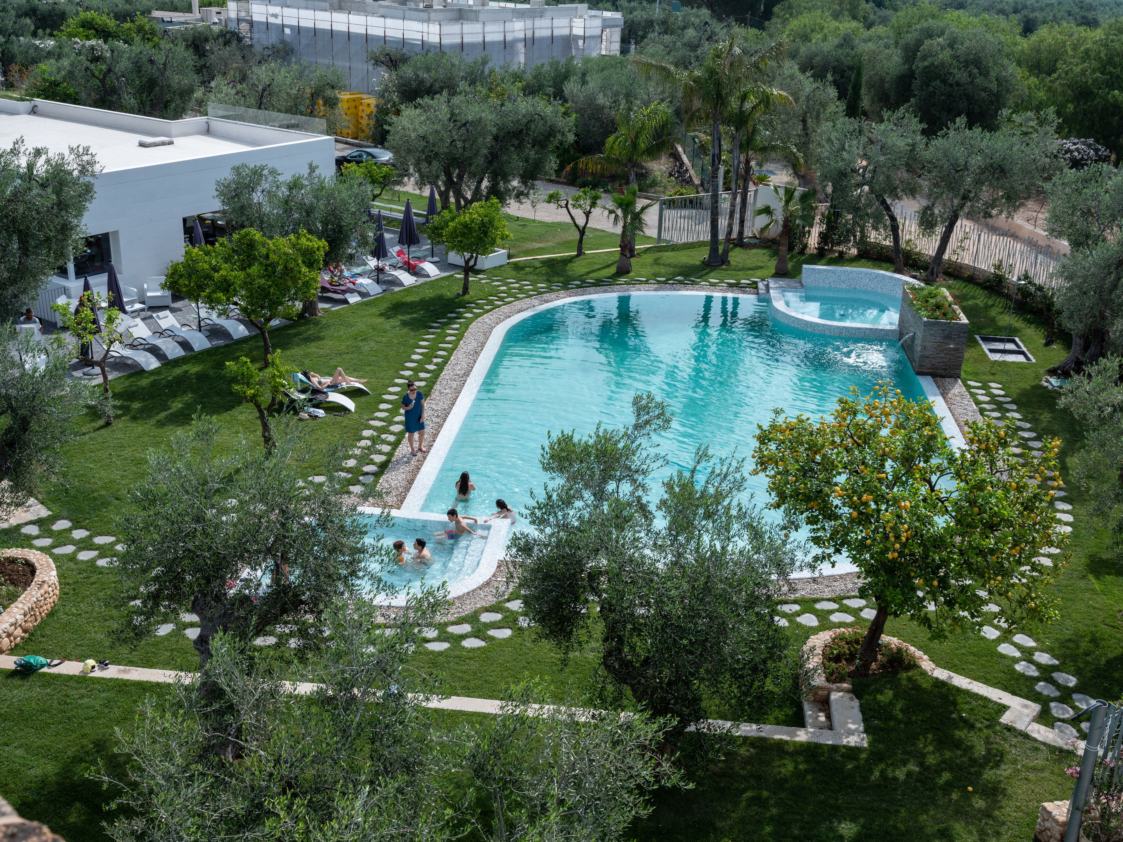 outdoor pool, pool umbrellas, pool loungers