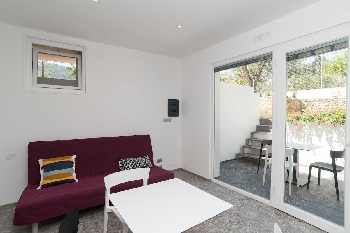 Classic Double Room, Kitchenette, Patio | Living area | Flat-screen TV