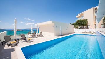 Seasonal outdoor pool, pool umbrellas, pool loungers