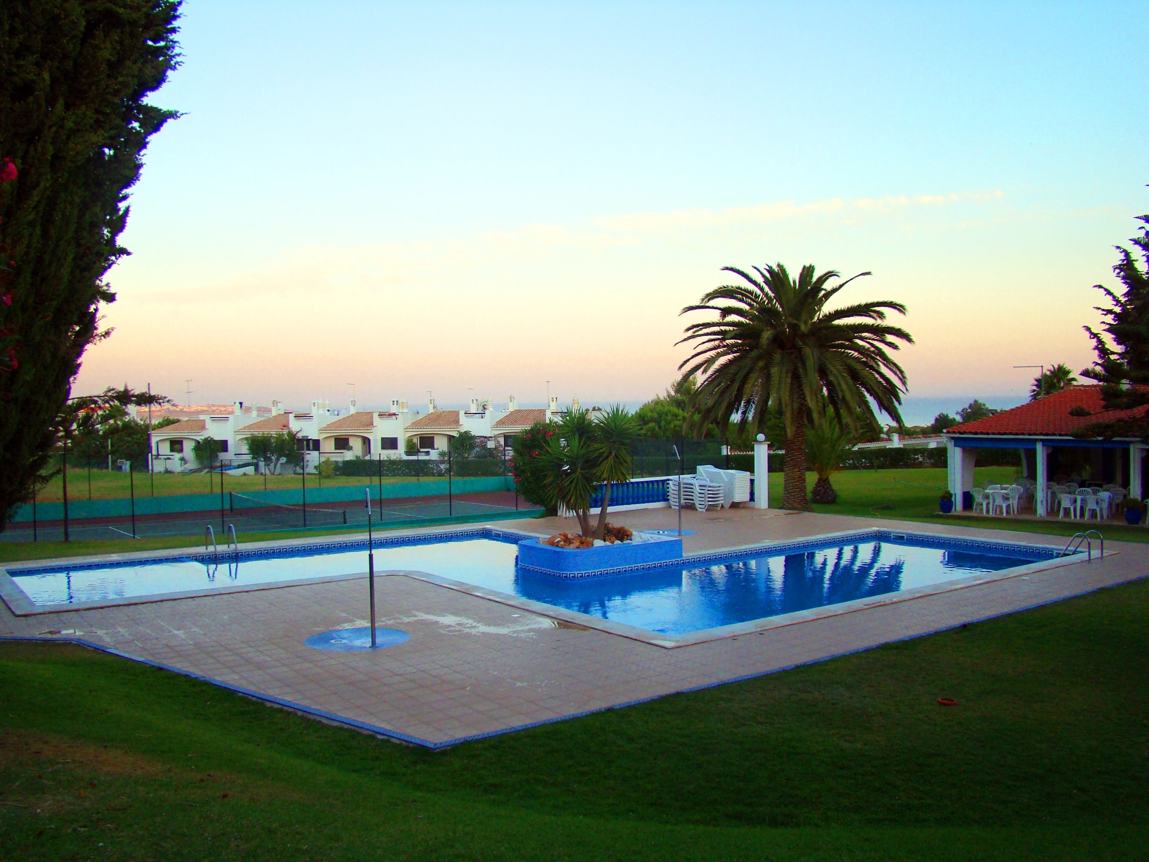 Outdoor pool, open 9:00 AM to 8:00 PM, pool umbrellas